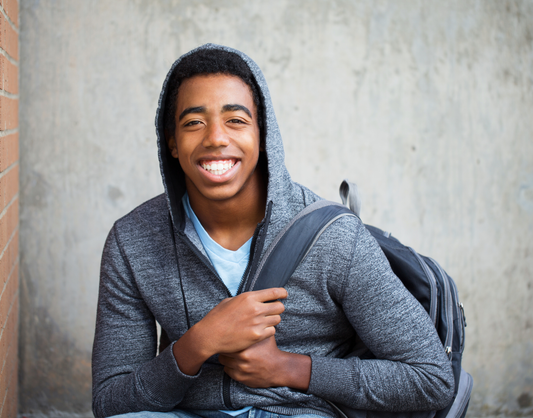 Food for Thought Therapy | 8 Things You Didn't Know About ARFID | Color image of boy smiling with a backpack over one shoulder